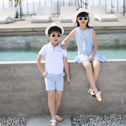 Kids in matching Korean-style summer outfits: boy in white polo and blue gingham shorts, girl in blue gingham dress. - Image 2
