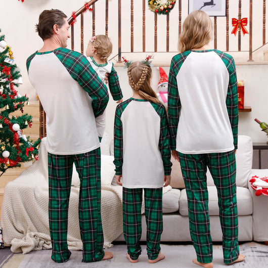 Family of four wearing matching green plaid Christmas pajamas with "Merry Christmas" and Christmas tree print. - Image 11