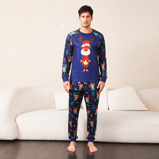 Family Christmas pajamas with a cartoon reindeer wearing a Santa hat and red scarf on a black top, and dark blue pants with a repeating reindeer and holly patte - Image 21