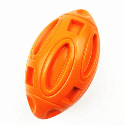 Green rubber rugby-shaped dog toy with textured surface and cut-outs, designed for chewing and play. - Image 13