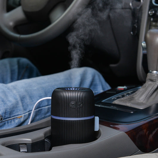 Black ribbed white noise humidifier with control buttons on top, designed to aid sleep and humidify. - Image 5