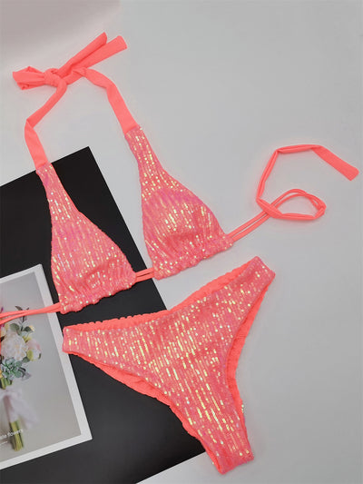 Pink and yellow sequined halter bikini top and high-cut bottoms on a model against a clear blue sky. - Image 26