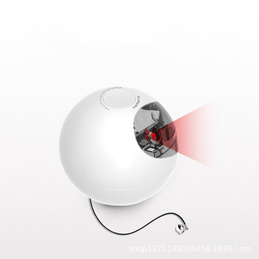 White smart automatic interactive cat toy ball with a red indicator light, being activated by a hand pressing its button. - Image 3