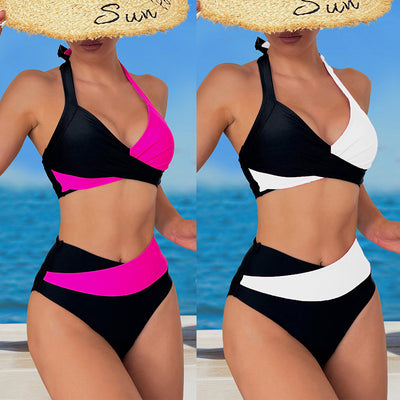 Black and white color-block halter bikini with high-waisted bottoms, modeled by a woman holding a straw hat.