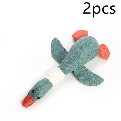 Plush teal duck dog toy with orange beak and feet, and a white ribbed neck, designed for sounding and puzzling. - Image 48