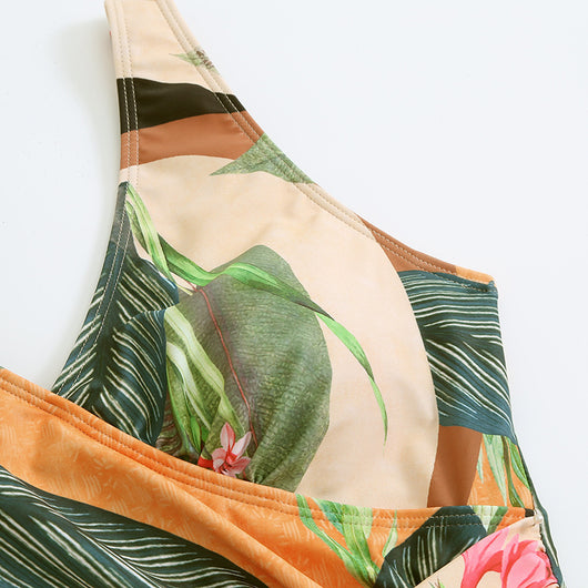 Two-piece tropical print swimsuit set with a V-neck one-piece and a matching long wrap skirt with tie waist. - Image 15