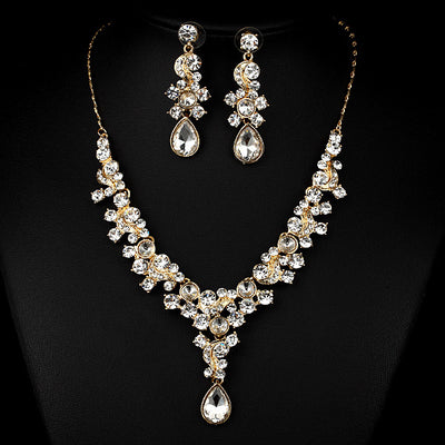 Pink and red rhinestone necklace and matching drop earrings set, featuring teardrop gems and floral scroll design. - Image 4