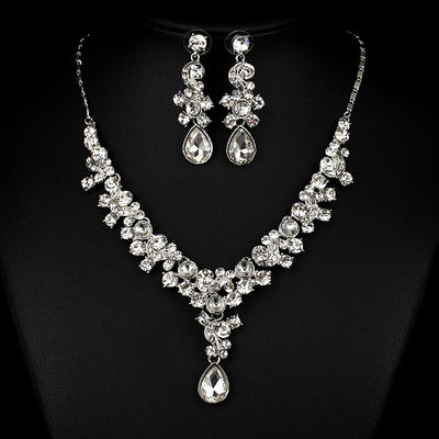 Pink and red rhinestone necklace and matching drop earrings set, featuring teardrop gems and floral scroll design. - Image 7