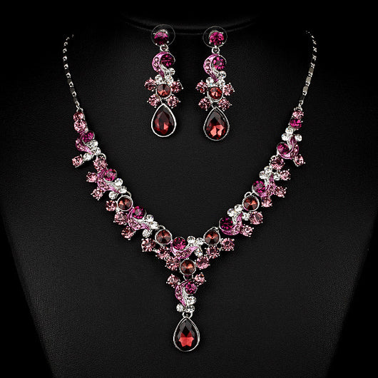 Pink and red rhinestone necklace and matching drop earrings set, featuring teardrop gems and floral scroll design. - Image 6