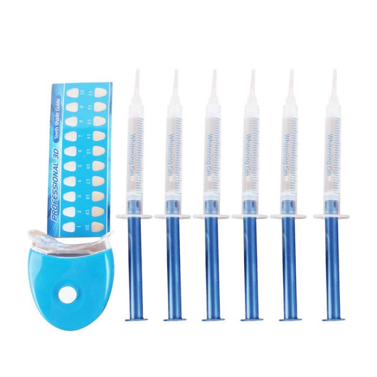 Teeth whitening kit with a blue LED light mouthpiece and a syringe of whitening gel on a white background. - Image 5