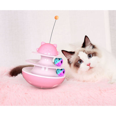 A playful kitten stands on its hind legs, batting at a dangling toy attached to a green and white multi-level cat track toy with rolling balls. - Image 5