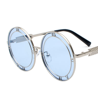 Round frame fashion sunglasses with light blue resin lenses and silver-tone metal frames featuring Roman numeral cutouts. - Image 11
