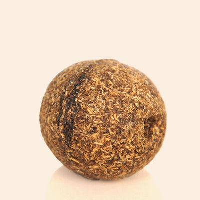 Natural catnip treat ball, spherical and covered in dried brown plant material, for cats to play with.