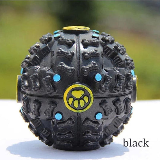 Black treat-dispensing dog toy ball with textured bone shapes, blue dots, and a yellow paw print logo. - Image 6