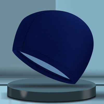 Black cloth swimming cap with a blue tribal-style graphic design on the side. - Image 14