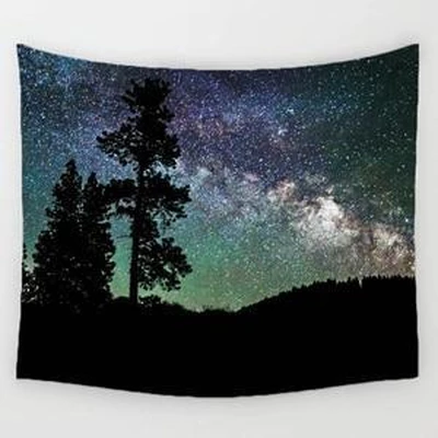 Rectangular tapestry featuring a vibrant night sky with the Milky Way, stars, and a silhouette of pine trees and a forest.