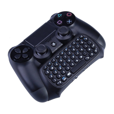 Black wireless keyboard attachment for PS4 game controller, featuring a full QWERTY layout and 3.5mm audio jack.