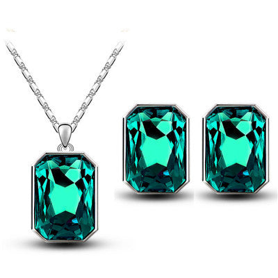 Teal rectangular crystal necklace and matching stud earrings set with silver-toned settings and chain. - Image 5