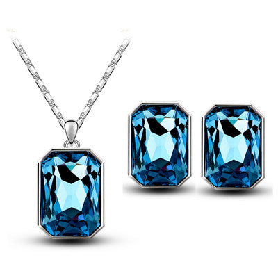 Teal rectangular crystal necklace and matching stud earrings set with silver-toned settings and chain. - Image 6