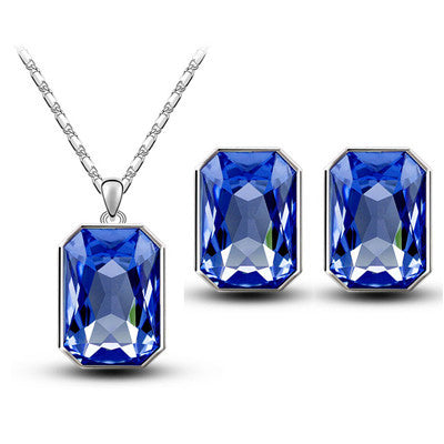 Teal rectangular crystal necklace and matching stud earrings set with silver-toned settings and chain. - Image 4