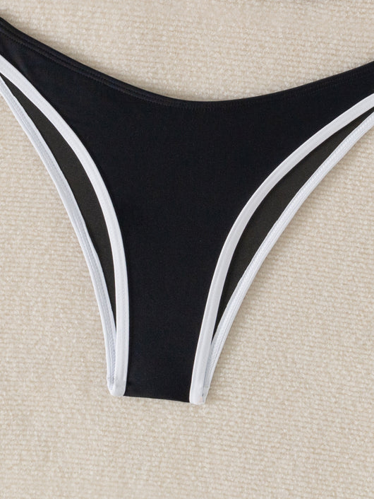 Black and white color block bikini with underwire top and high-cut bottoms, modeled by a woman by a pool. - Image 11