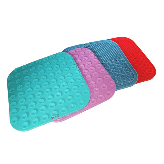 Gray silicone pet licking pad with four textured sections, designed for slow feeding and anti-choking. - Image 38