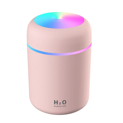 Dark gray ultrasonic aromatherapy essential oil diffuser with a colorful LED light band and rainbow top light. - Image 10
