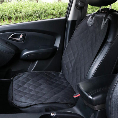 Black quilted pet car seat cover installed on a front passenger seat, protecting the upholstery. - Image 3