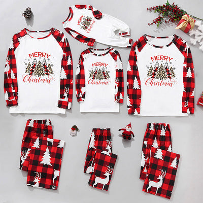 Matching family Christmas pajamas in red and black plaid with "Merry Christmas" text, tree, and reindeer prints. - Image 11