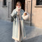 Loose-Fit Long Fur Coat with Stand-Up Collar and Decorative Stitching