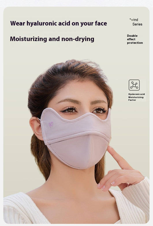 Woman wearing a grey outdoor cycling wind mask with ear hooks and a small heart logo, designed for cold-proof eye protection. - Image 18