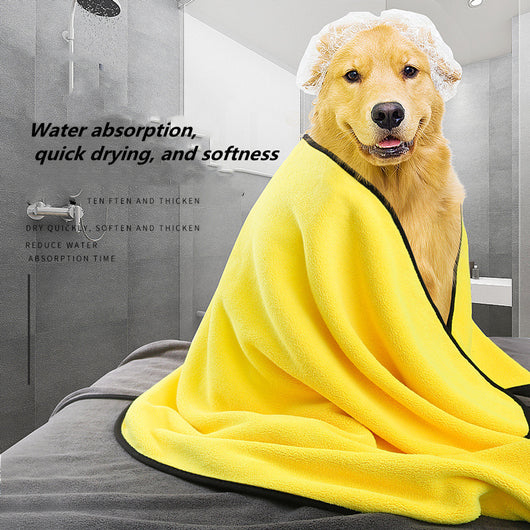 Yellow microfiber pet drying towel with black trim draped over a bathtub, with a golden retriever, poodle, and cat.