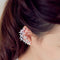 Aretes Asimétricos de Flor de Cuatro Pétalos
