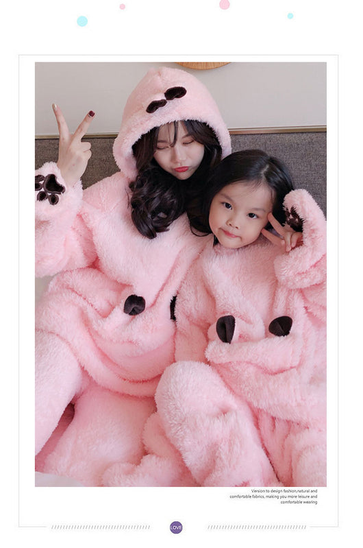 Mother and child wearing matching brown plush bear pajamas with hoods, ears, and embroidered paw gloves. - Image 12
