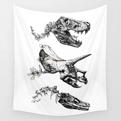 White tapestry featuring black and white illustrations of three dinosaur skulls intertwined with delicate floral vines.
