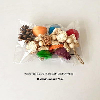 Blue parrot playing with a colorful natural material bird toy featuring corn cobs, wood, and pinecones, hanging in a white birdcage. - Image 13