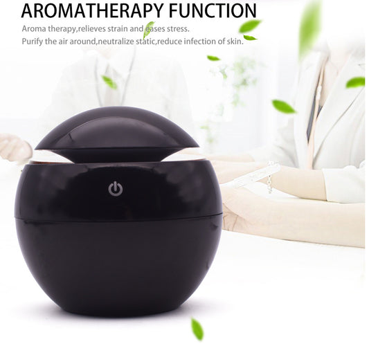 Black spherical ultrasonic atomizer with a power button icon, designed for aromatherapy and humidification. - Image 2