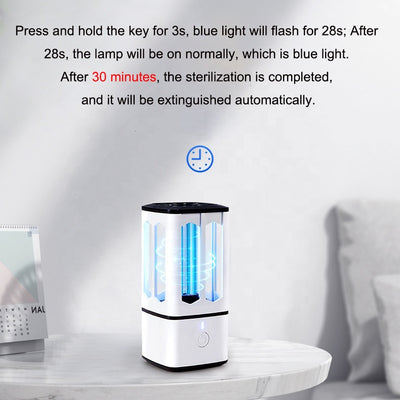 White portable UV disinfection lamp with a black top and base, featuring a visible blue UV light tube and power button. - Image 4