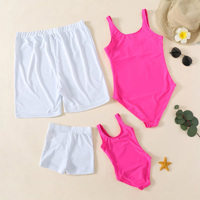 Rose pink one-piece swimsuit with 'QUEEN' printed in white on the front, featuring a scoop neck and tank straps. - Image 2