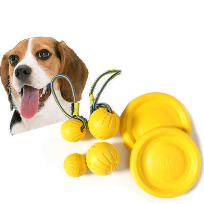 Bright yellow EVA pet ball dog toy with textured grooves and paw print details for interactive play.