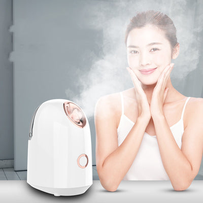 White and rose gold steam facial sprayer emitting warm mist, shown on a light wooden table. - Image 4