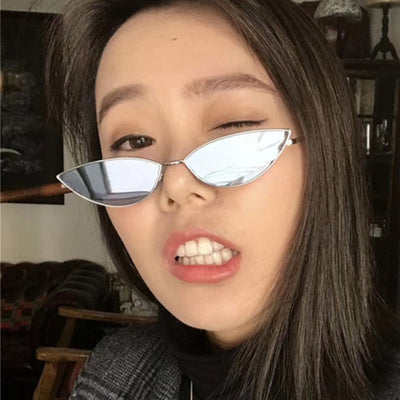Retro cat eye sunglasses for women with bright yellow lenses and a sleek silver-tone metal frame. - Image 2