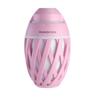 Light green football-shaped humidifier with a decorative lattice pattern and a power button on top. - Image 23
