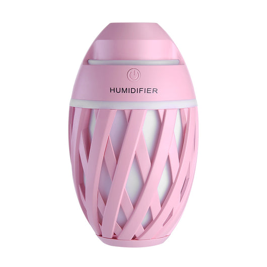 Light green football-shaped humidifier with a decorative lattice pattern and a power button on top. - Image 23