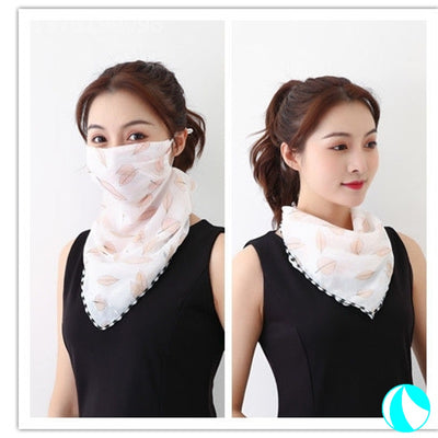 White women's UV protection scarf with black speckle pattern, worn as a face mask and neck scarf. - Image 13