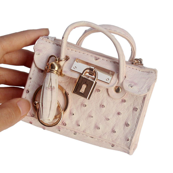Bolso de Mano Minimalista en Cuero con Borlas