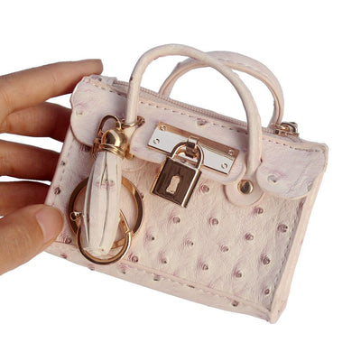 Bolso de Mano Minimalista en Cuero con Borlas - Image 2