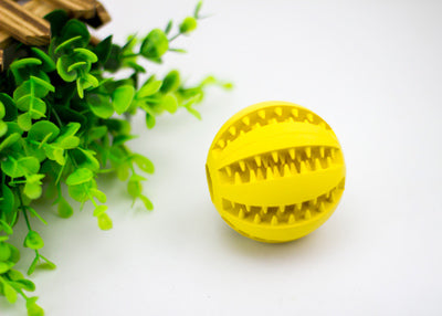 Bright green rubber pet toy ball with textured spikes and ridges for dental cleaning and food dispensing. - Image 13