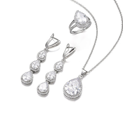Green pear-shaped gemstone jewelry set with necklace, dangle earrings, ring, and bracelet, all with clear stone accents. - Image 9