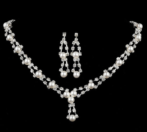 Silver-tone bridal jewelry set with a pearl and rhinestone necklace and matching dangle earrings.